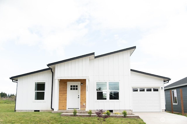 1022 Peach Rd, Winlock, WA 98596 - modern inspired farmhouse with board and batten siding, an attached garage, concrete driveway, crawl space, and a front yard