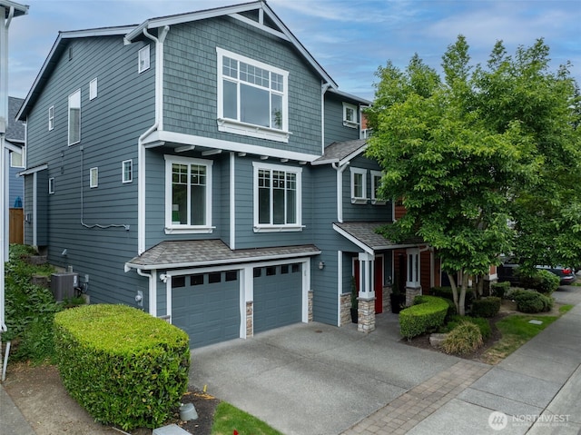 17826 20th Ave SE, Bothell, WA 98012 - craftsman-style house with a garage, driveway, and a shingled roof