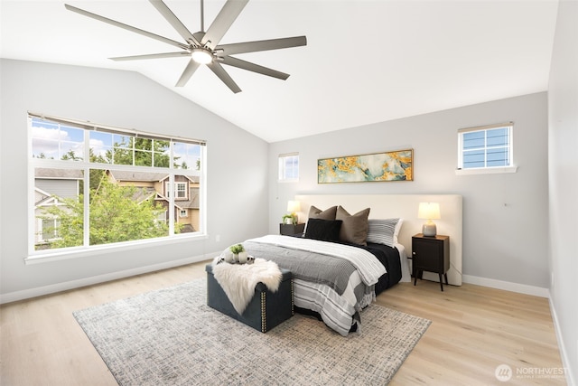 17826 20th Ave SE, Bothell, WA 98012 - bedroom with light wood-type flooring, multiple windows, vaulted ceiling, and ceiling fan
