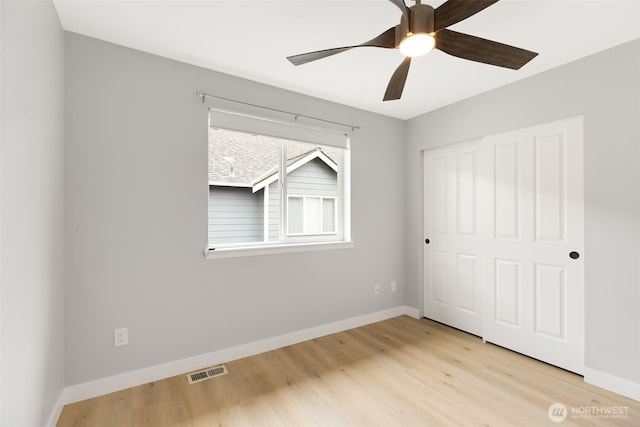 17826 20th Ave SE, Bothell, WA 98012 - unfurnished bedroom with a closet, light wood-style floors, and a ceiling fan