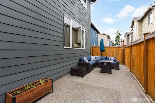 17826 20th Ave SE, Bothell, WA 98012 - fenced backyard featuring an outdoor living space, a patio, and a vegetable garden