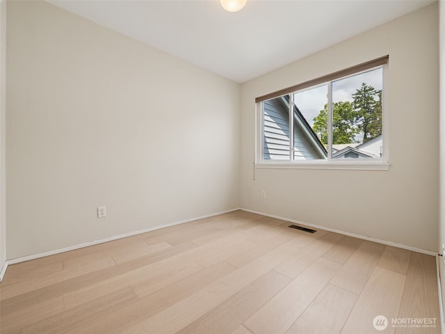 23501 112th Ave SE Unit M104, Kent, WA 98031 - unfurnished room featuring baseboards and light wood-type flooring