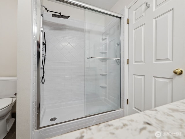 23501 112th Ave SE Unit M104, Kent, WA 98031 - bathroom with toilet and a stall shower