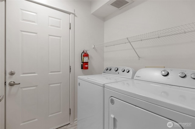 2009 196th St SE Unit G104, Bothell, WA 98012 - laundry room with washing machine and clothes dryer