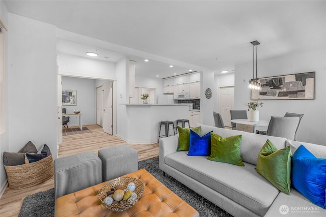 2009 196th St SE Unit G104, Bothell, WA 98012 - living room featuring light wood-type flooring, recessed lighting, and baseboards