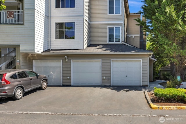 2009 196th St SE Unit G104, Bothell, WA 98012 - garage featuring asphalt driveway