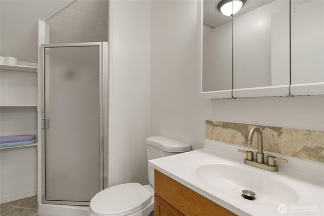 330 Highland Ave, Chelan, WA 98816 - bathroom featuring a stall shower, vanity, and toilet