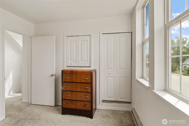 330 Highland Ave, Chelan, WA 98816 - bedroom featuring carpet, baseboards, and multiple closets