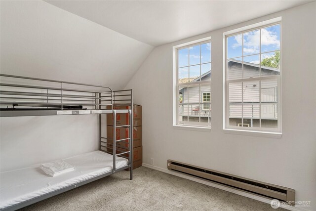 330 Highland Ave, Chelan, WA 98816 - unfurnished bedroom featuring a baseboard radiator, lofted ceiling, carpet, and baseboards