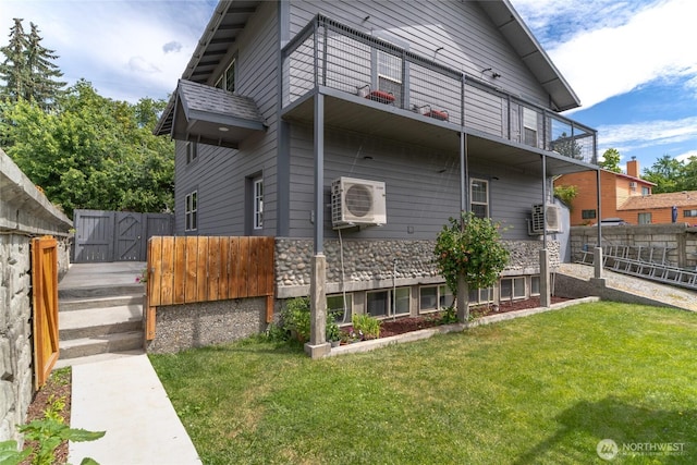 330 Highland Ave, Chelan, WA 98816 - back of property with a balcony, ac unit, a gate, and stone siding