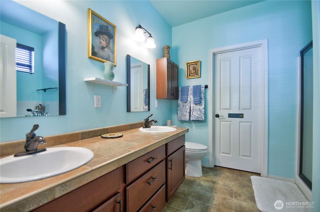 9127 Perwinkle Loop NE, Olympia, WA 98516 - full bath with double vanity, toilet, and baseboards