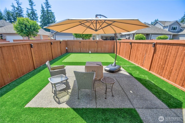 9127 Perwinkle Loop NE, Olympia, WA 98516 - fenced backyard with a putting area and a patio