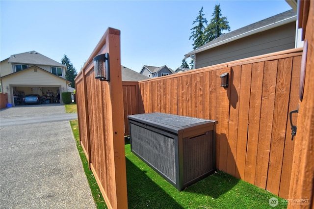 9127 Perwinkle Loop NE, Olympia, WA 98516 - view of yard with a cooling unit and a garage