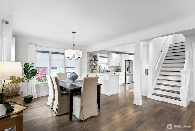 3236 15th Ave S, Seattle, WA 98144 - dining area with dark wood-style floors, stairs, and a chandelier