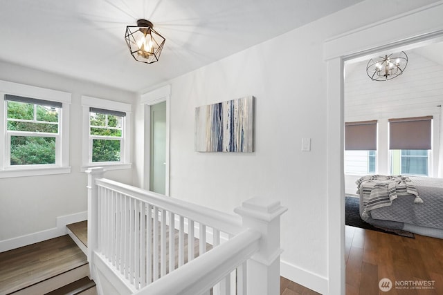 3236 15th Ave S, Seattle, WA 98144 - hallway with a chandelier, an upstairs landing, and wood finished floors