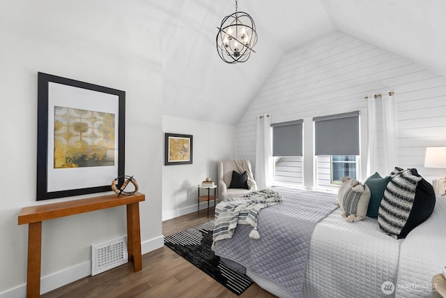 3236 15th Ave S, Seattle, WA 98144 - bedroom featuring vaulted ceiling, wood finished floors, wood walls, and a chandelier