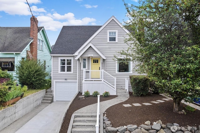 3236 15th Ave S, Seattle, WA 98144 - view of front facade featuring concrete driveway, a garage, and roof with shingles