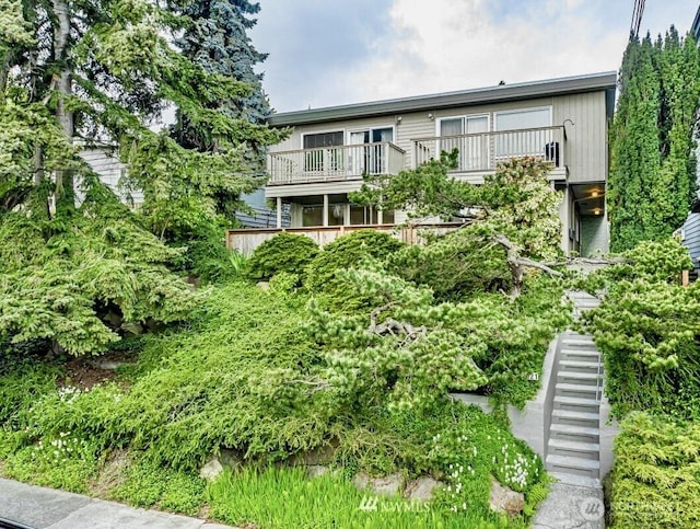 3021 21st Ave W, Seattle, WA 98199 - view of front facade with stairway and a balcony