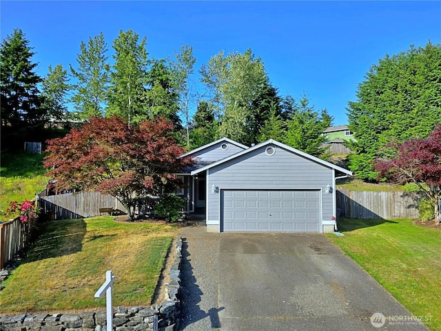 19523 71st Ave E, Spanaway, WA 98387 - view of front facade featuring a garage and asphalt driveway