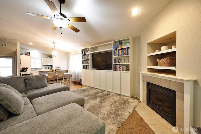19523 71st Ave E, Spanaway, WA 98387 - living room featuring vaulted ceiling, ceiling fan, a fireplace, light tile patterned flooring, and recessed lighting