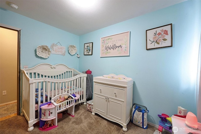19523 71st Ave E, Spanaway, WA 98387 - carpeted bedroom with a crib and baseboards