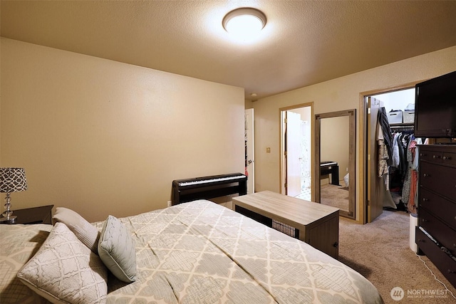 19523 71st Ave E, Spanaway, WA 98387 - bedroom with light colored carpet, a walk in closet, and a closet