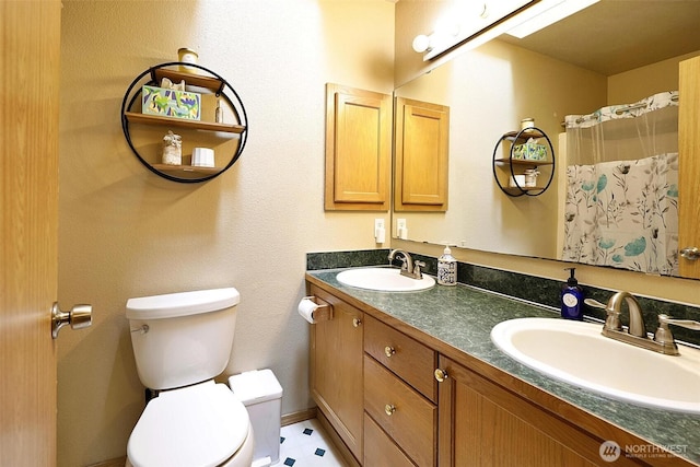 19523 71st Ave E, Spanaway, WA 98387 - bathroom featuring toilet and double vanity