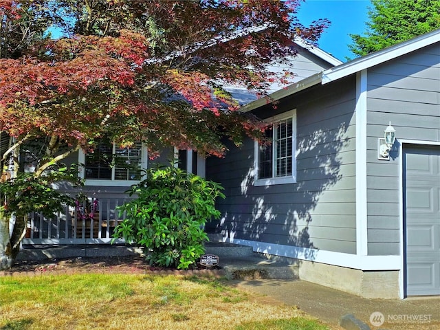 19523 71st Ave E, Spanaway, WA 98387 - view of side of home with a garage