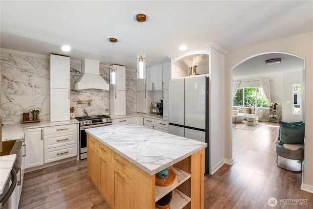 18113 17th Avenue Ct E, Spanaway, WA 98387 - kitchen featuring stainless steel gas stove, custom exhaust hood, open shelves, freestanding refrigerator, and recessed lighting
