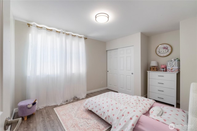 18113 17th Avenue Ct E, Spanaway, WA 98387 - bedroom with wood finished floors and a closet