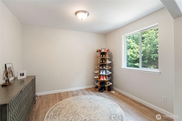 18113 17th Avenue Ct E, Spanaway, WA 98387 - miscellaneous room featuring light wood-type flooring and baseboards