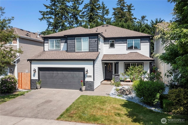 18113 17th Avenue Ct E, Spanaway, WA 98387 - view of front of house featuring a garage, asphalt driveway, roof with shingles, and a front yard