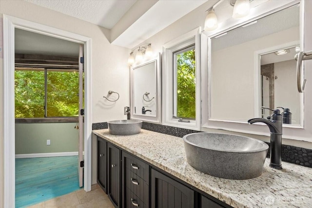 41506 292nd Way SE, Enumclaw, WA 98022 - bathroom featuring double vanity and baseboards
