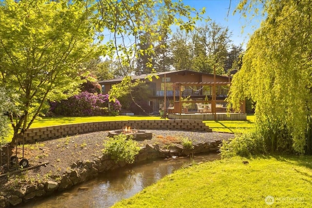 41506 292nd Way SE, Enumclaw, WA 98022 - view of property's community featuring a fire pit, a yard, and a deck