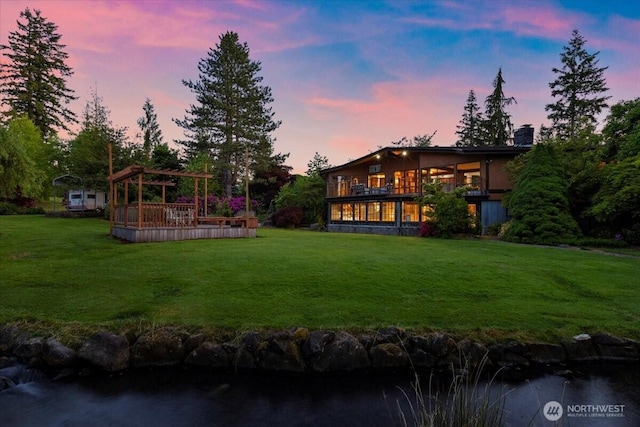 41506 292nd Way SE, Enumclaw, WA 98022 - yard at dusk with a yard and a deck