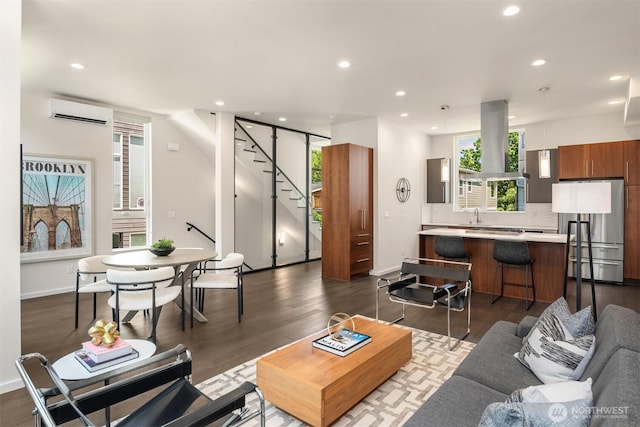 818 25th Ave S Unit A, Seattle, WA 98144 - living room featuring a wall unit AC, stairs, recessed lighting, and dark wood-type flooring