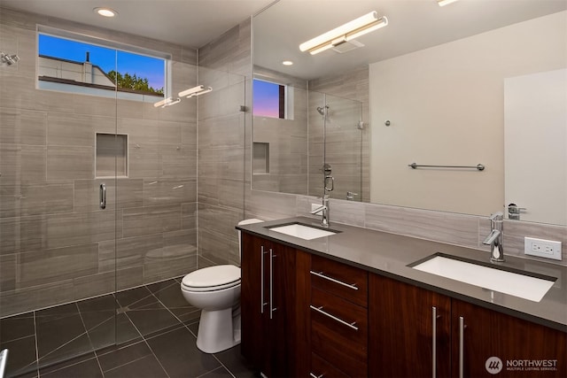 818 25th Ave S Unit A, Seattle, WA 98144 - full bathroom with double vanity, a stall shower, tile patterned flooring, and recessed lighting