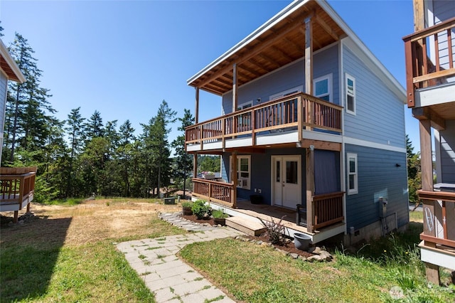 585 Finnegan Rdg, Friday Harbor, WA 98250 - back of house featuring a balcony and a yard