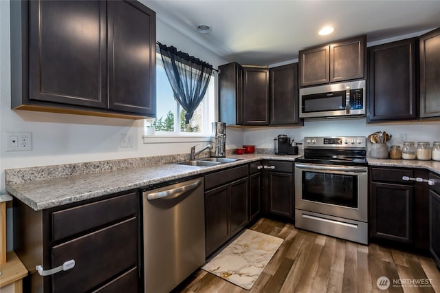 585 Finnegan Rdg, Friday Harbor, WA 98250 - kitchen with stainless steel appliances, dark wood-type flooring, light countertops, recessed lighting, and dark brown cabinets