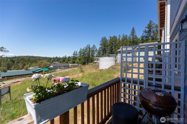 585 Finnegan Rdg, Friday Harbor, WA 98250 - wooden deck featuring area for grilling and a forest view