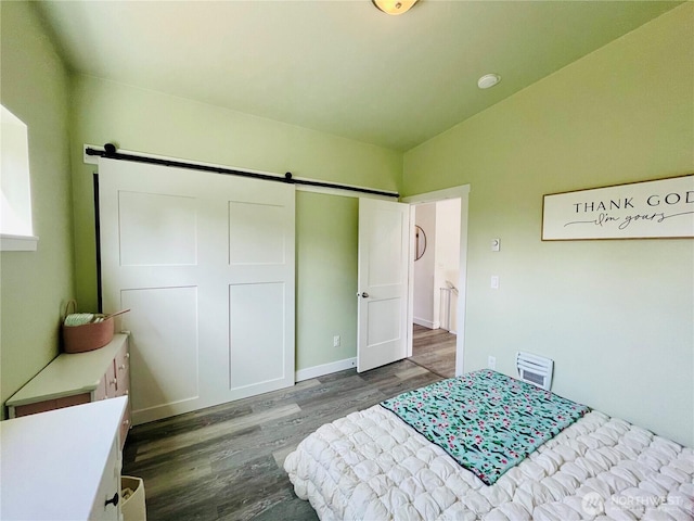 585 Finnegan Rdg, Friday Harbor, WA 98250 - bedroom featuring a barn door and wood finished floors