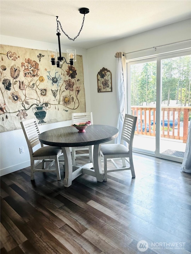 585 Finnegan Rdg, Friday Harbor, WA 98250 - dining room with a chandelier and dark wood-style flooring