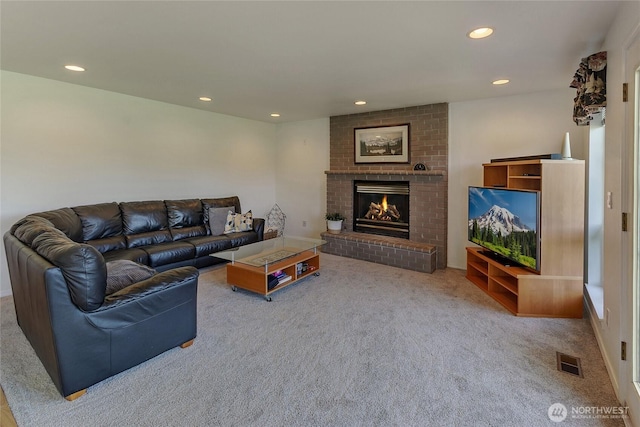 11207 16th St E, Edgewood, WA 98372 - living area with carpet, a fireplace, and recessed lighting