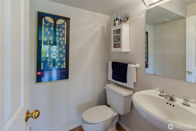 11207 16th St E, Edgewood, WA 98372 - bathroom with a sink, toilet, and baseboards