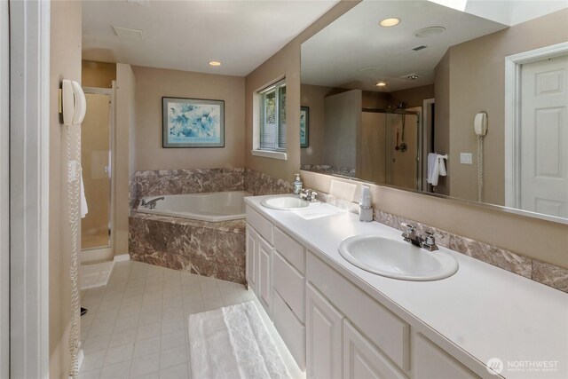 11207 16th St E, Edgewood, WA 98372 - full bath with a stall shower, a bath, double vanity, tile patterned flooring, and recessed lighting