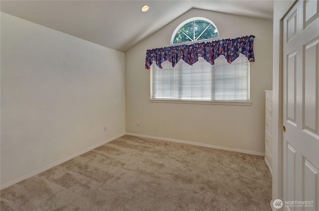11207 16th St E, Edgewood, WA 98372 - spare room with carpet floors, lofted ceiling, and baseboards