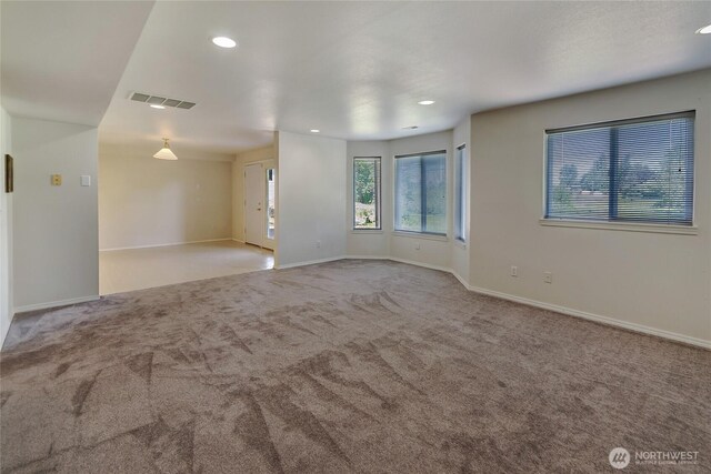 11207 16th St E, Edgewood, WA 98372 - spare room featuring carpet floors, baseboards, and recessed lighting