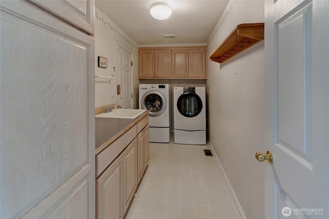 11207 16th St E, Edgewood, WA 98372 - laundry room with washer and dryer, cabinet space, and baseboards