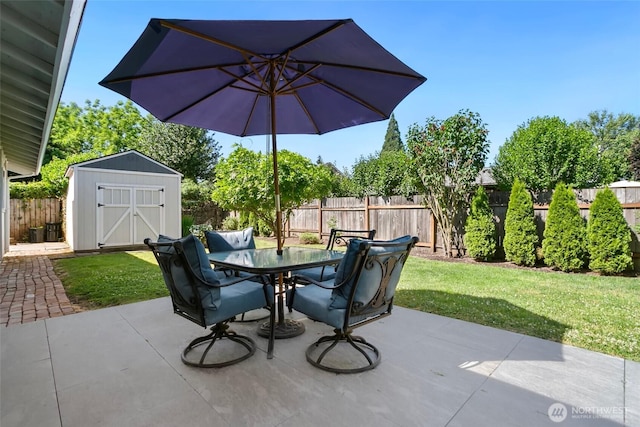 1980 Mckinley St, Enumclaw, WA 98022 - fenced backyard featuring a storage unit, a patio area, and outdoor dining space