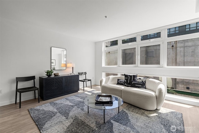 17 W Mercer St Unit 216, Seattle, WA 98119 - living area featuring light wood finished floors and baseboards